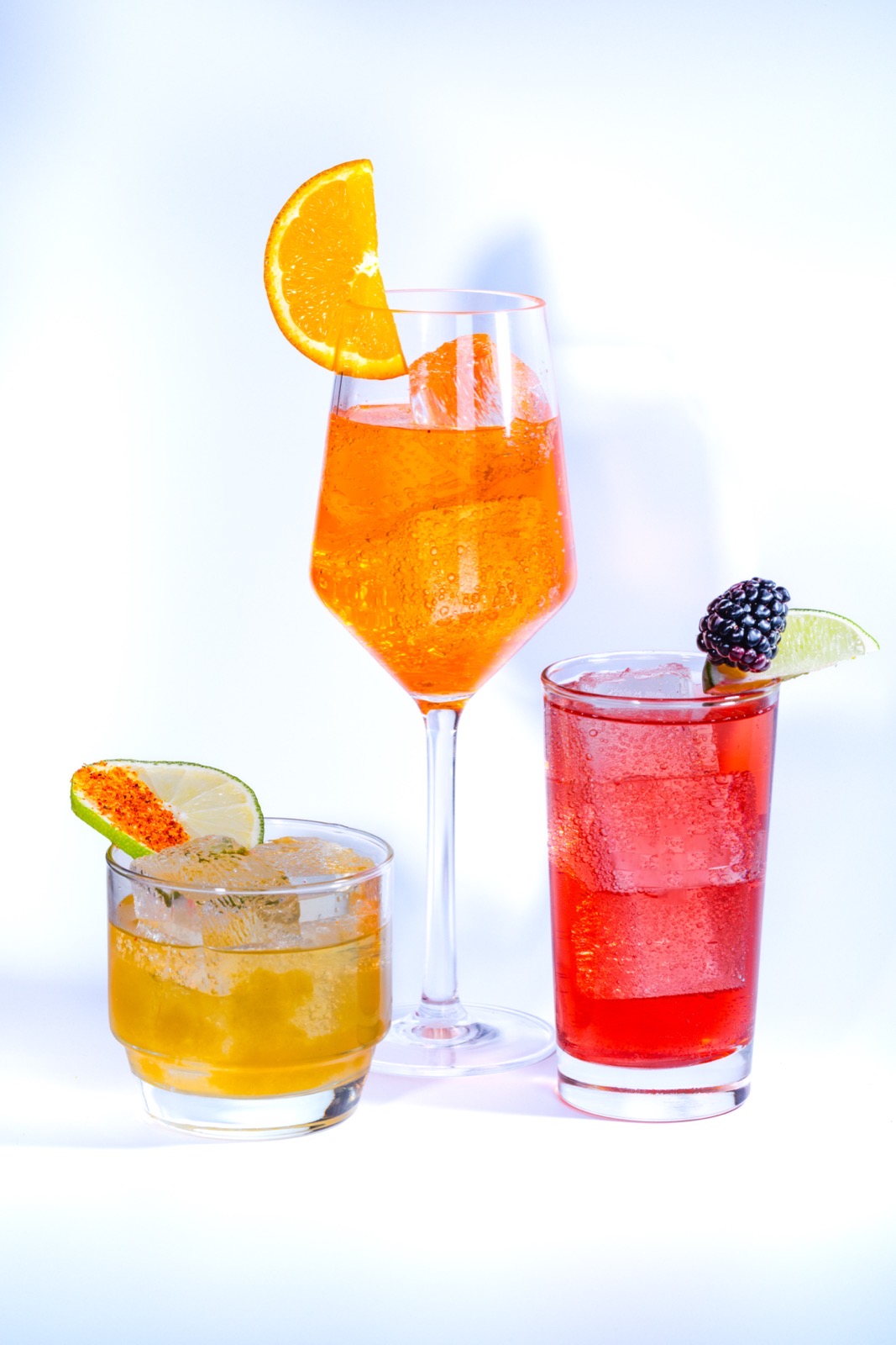 The three Novel cocktails — Mango Margarita, Passion Fruit Spritz, and Blackberry Mule